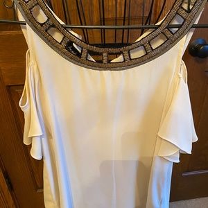 Cream cold shoulder blouse trimmed in gold
